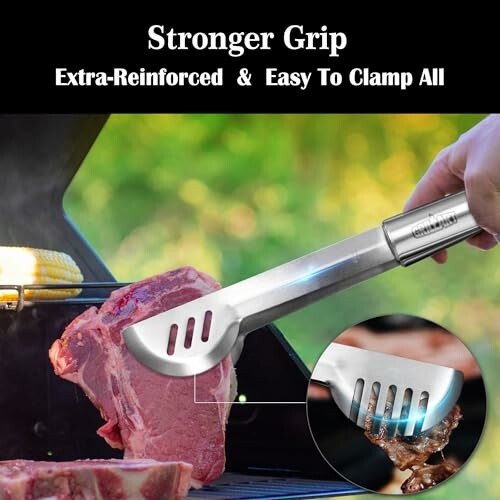 Stainless steel tongs gripping steak on grill