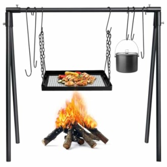 Outdoor campfire grill with hanging pot and cooking food.