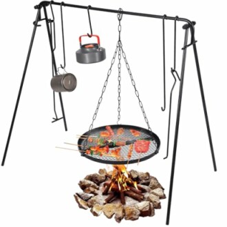 Campfire cooking tripod with grill and hanging pots.