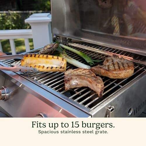 Grill with vegetables and meat cooking, fits up to 15 burgers.