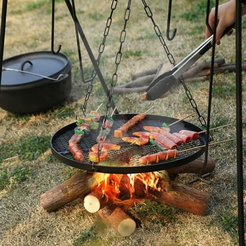 Grilling meat and vegetables over a campfire.