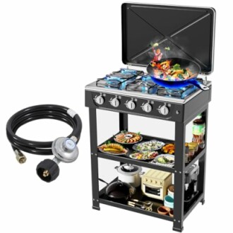 Outdoor gas stove with cooking accessories and food.