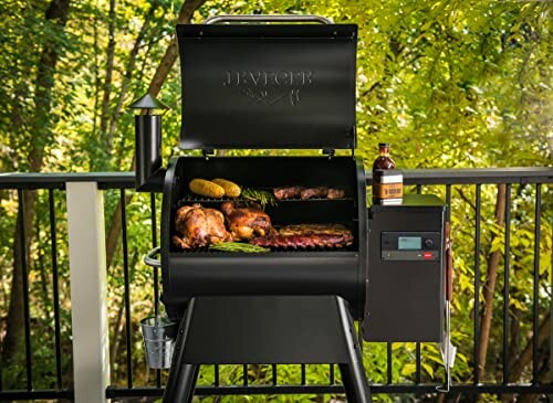 Outdoor grill with various meats and vegetables.