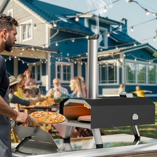 Man using outdoor pizza oven with group at table in backyard.