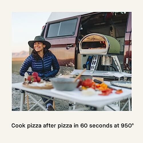 Woman camping with portable pizza oven and van.