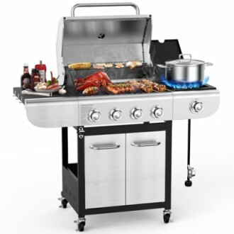 Stainless steel gas grill with food and cooking pot.